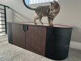 Cargar la imagen en la vista de la galería, (Dark) Bengal kitten confidently perched on a stylish black cat litter box condo, highlighting the perfect blend of luxury and practicality in cat furniture
