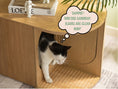 Load image into Gallery viewer, (Light) An adorable cat comfortably using the spacious interior of a Poop Lounge, highlighting the litter box enclosure's practicality and cat-friendly design
