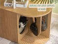 Load image into Gallery viewer,  (Light) A curious cat peeking out from a hidden litter box enclosure with storage shelves for cat essentials, illustrating the perfect blend of functionality and style
