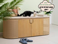 Charger l'image dans la visionneuse de la galerie, (Light) A cat lounging atop a hidden storage cat enclosure that doubles as chic furniture, inviting cat owners to experience the convenience and style of the Poop Lounge
